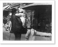 Historic Framed Print, [Chinese in Chinatown, San Francisco, on street: Man with long pigtail holding child],  17-7/8" x 21-7/8"