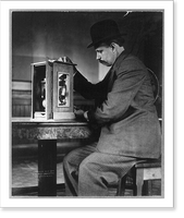 Historic Framed Print, [Man seated with a stamp vending machine],  17-7/8" x 21-7/8"