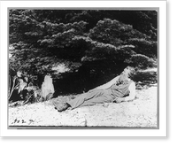 Historic Framed Print, [John Muir, full-length portrait, facing left, lying on rock with trees in background],  17-7/8" x 21-7/8"