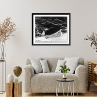 Historic Framed Print, [John Muir, full-length portrait, facing left, lying on rock with trees in background],  17-7/8" x 21-7/8"