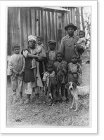 Historic Framed Print, [Red Cross relief, drought of 1930-31: Typical African American family of 9, destitute because of the drought, posed in front of house],  17-7/8" x 21-7/8"