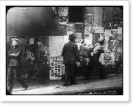 3 men, one with basket strapped to back, walking past wall plastered with handbills. Chinatown, San Francisco. ca. 1900, Antique Wall Art
