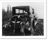 Hunter with ducks seated on bumper of Hudson automobile, in Idaho, Antique Poster