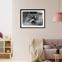 Historic Framed Print, Little Julia tending the baby at home. All the older ones are at the factory. She shucks also. Alabama Canning Co.,. Location: Bayou La Batre, Alabama.,  17-7/8" x 21-7/8"