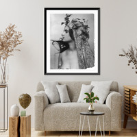 Young woman modeling: head and shoulders, facing left, vines on head, and meshed fabric draped from head over body, Vintage Poster