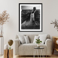 Historic Framed Print, [Young woman modeling: hanging on cross in sea],  17-7/8" x 21-7/8"