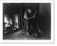Adirondack Mountains, N.Y.: Absorbed - man reading by fireplace, Historic Print