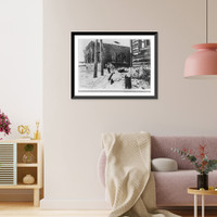 German army in Russia, April 1942: two German soldiers pulling sledge through snowy street, Vintage Wall Art