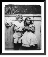 Historic Framed Print, [Boy and girl posed, three-quarter length, standing, holding large cup],  17-7/8" x 21-7/8"
