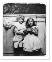 Historic Framed Print, [Boy and girl posed, three-quarter length, standing, holding large cup],  17-7/8" x 21-7/8"