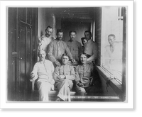 Group of 7 Signal Corps members posed in hallway and 2 Filipinos in background, Philippine Islands, 1899, Historic Print
