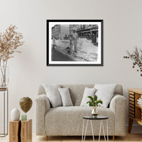 Street types of New York City: Street cleaner with pick ax standing in front of pile of snow, Vintage Print