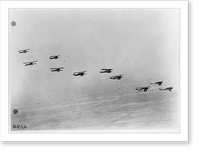 View from airplane of biplanes flying in formation: Side view of airplanes, Vintage Poster