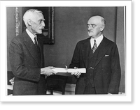 Secretary of the Treasury Andrew Mellon presents Walter E. Hope, of New York, who was sworn in today as Assistant Secretary of the Treasury, with his commission shortly after the ceremony at Washin