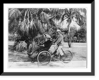 Joe Jefferson on seat on front of quadricycle being peddled by another man, Palm Beach, Fla. Classic, Vintage Poster
