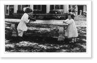 One child aiming camera, on bench, at another child, Washington, D.C. Classic, Vintage Poster