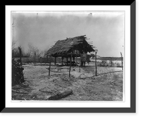 Goldes man in front of thatched-roof store-house built on stilts, Antique Wall Art