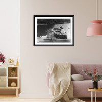 Historic Framed Print, Helen Keller, half. lgth., seated in boat, left profile; feeding swan,  17-7/8" x 21-7/8"