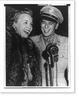 Ronald Reagan in uniform and Jane Wyman wearing fur at microphone, Antique Print