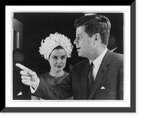 John F. Kennedy and Grace Kelly. Both half lgth. Grace Kelly looking at John Kennedy, who is pointing with his right hand, Vintage Print