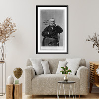 Walt Whitman, three-quarter length portrait, seated, facing slightly right, wearing heavy coat with right hand in pocket, left hand at cheek, Vintage Wall Art