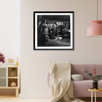 Historic Framed Print, [Andrew Scavnicky and his buddy, John Mikula, coal miners, loafing in Andrew's workshop, with dog, Hazelton, Pa.: Interior with Andrew warming his hands at stove],  17-7/8" x 21-7/8"