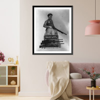 Advertisement display showing boy holding air rifle and 3 other Daisy air rifles on rack, Antique Print