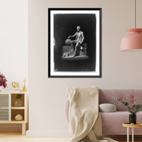 Sculpture of sitting man with his hand on globe and sacks of money at his feet Classic, Historic Reproduction