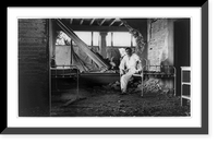 Historic Framed Print, [Mexican Revolution: Interior of ruins of building with man seated on bed],  17-7/8" x 21-7/8"