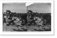 Two men giving artificial respiration to another man on beach as crowd watches Classic, Vintage Poster