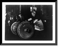 American woman of Italian descent employed as a grinder and hooker, rolling heavy wheel to machines Classic, Antique Print