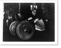 American woman of Italian descent employed as a grinder and hooker, rolling heavy wheel to machines Classic, Antique Print