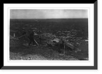 French civilians repairing road in Hooge, Belgium, after battle. The land is one succession of shell craters, now filled with water. Ruins of Ypres in the extreme distance Antique Wall Art Print