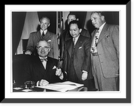 Good new for the Philippines. President Truman holds souvenir pens used in the signing ceremony of the Philippine Rehabilitation and Trade Bill at the White House after the signing Classic Wall Art