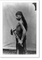 Historic Framed Print, [Dyak man, Singapore, standing, three-quarter length portrait, facing left],  17-7/8" x 21-7/8"