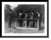 Historic Framed Print, Training a policewoman. target practice under the direction of Inspector Cross of the police department. Inspector Cross demonstrates the correct way to hold a gat"",  17-7/8" x 21-7/8"