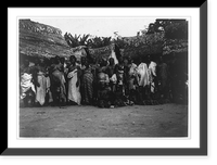 Group of Ashanti posed in front of huts, Kumasi, Gold Coast, Vintage Print