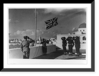 The Union Jack being hoisted on an Italian flagpole in Benghazi after the city's recapture, showing British soldiers saluting, Vintage Wall Art
