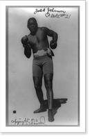 Historic Framed Print, [Jack Johnson, full-length portrait, standing facing front, wearing boxing shorts and boxing gloves],  17-7/8" x 21-7/8"