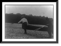 Theodore Roosevelt carrying boat with another man while a third carries oars, Antique Poster