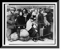 German displaced persons, carrying their few belongings, crowd behind a rope and double strand of barbed wire as they wait in Berlin's Anhalter Station to leave the German capital Timeless Wall A