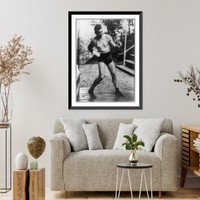 Historic Framed Print, [Jack Dempsey, full-length portrait, standing, facing right, training at Michigan City, Indiana],  17-7/8" x 21-7/8"