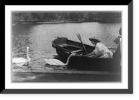 Historic Framed Print, [Helen Keller, half-length portrait, facing left, sitting in boat feeding swan],  17-7/8" x 21-7/8"