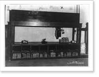 Interior view of a Piggly Wiggly self-service grocery store showing scales on top of counter and paper bags stored under counter, Historic Reproduction