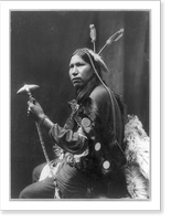Historic Framed Print, [Afraid of Hawk, three-quarter length portrait, seated, facing left; holding tomahawk],  17-7/8" x 21-7/8"