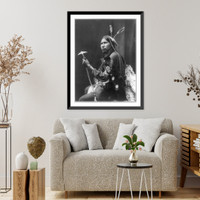 Historic Framed Print, [Afraid of Hawk, three-quarter length portrait, seated, facing left; holding tomahawk],  17-7/8" x 21-7/8"