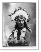 Running Horse, half-length portrait, facing slightly right with arms folded; wearing feather headdress and bone breast plate, Antique Poster