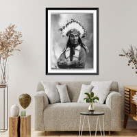 Running Horse, half-length portrait, facing slightly right with arms folded; wearing feather headdress and bone breast plate, Antique Poster
