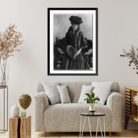 Miss A. L. Ide, three-quarter-length portrait, standing, facing right, wearing fur coat, plumed hat and muff, Historic Print