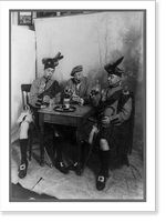 Two men wearing kilts and man smoking cigar, seated at small table drinking Sandy MacDonald scotch, Vintage Poster